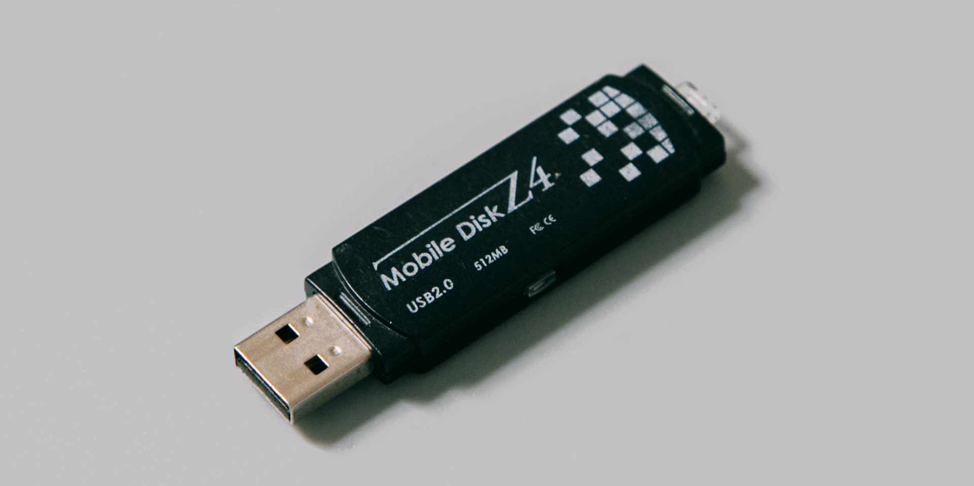 A USB drive on a gray background.