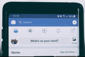 Facebook's "What's on your mind?" option open on a phone.