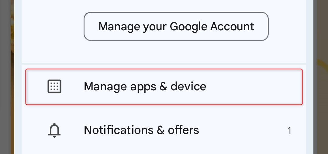 "Manage apps & device" option highlighted in account menu.