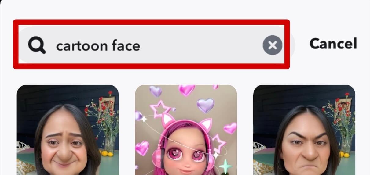 "cartoon face" encoded in Snapchat lens search bar.